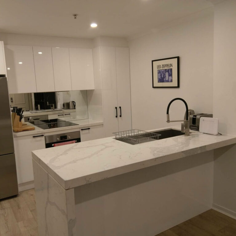Professional cleaner deep cleaning a kitchen surface