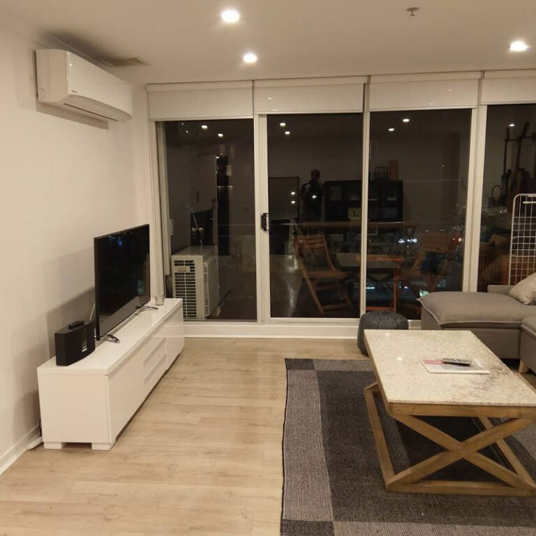 Professional cleaner cleaning a residential living room