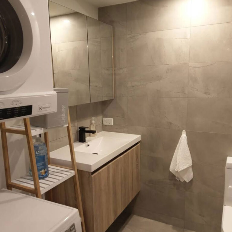 Professional cleaner deep cleaning bathroom surfaces and fixtures